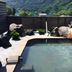 Minshuku Unagi Kohan in Ibusuki features an outdoor pool beside a scenic mountain and lake view.