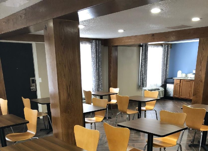 Super 8 by Wyndham Asheville/Biltmore breakfast area with tables and chairs in Asheville
