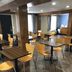 Super 8 by Wyndham Asheville/Biltmore breakfast area with tables and chairs in Asheville