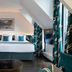 Hôtel Aoriste & Spa Paris guest room with a bed, mirrored closet, and angled ceiling window