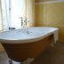 La Maison De Maitre in Arbrefontaine bathroom with freestanding tub beside a window
