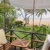 Bann Pae Cabana Hotel And Resort in Rayong with patio seating overlooking the beach and palm trees