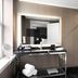 The Warrior Hotel, Autograph Collection bathroom vanity with black marble shower in Sioux City