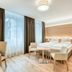 Hotel Leipziger Hof Innsbruck guest room with double bed, seating area, and large window