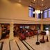 Clarks Khajuraho lobby with high ceilings, chandeliers, seating area and large windows in Khajurāho