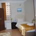 Lotus Hotel Istanbul room with single bed, wardrobe, window and wall-mounted TV