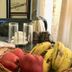 Katero in Pokhara room with fruit basket, tea set, and leather armchair
