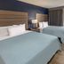 Baymont by Wyndham Laredo guest room with two beds and a window view in Laredo