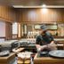 Hotel Chanti Semarang buffet station with chef preparing food in a wood-paneled dining area