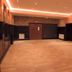 The Bull And Bush Hotel Kingston in Kingston upon Thames, empty event room with fireplace and wood flooring