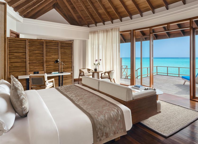 Anantara Dhigu Maldives Resort villa bedroom with oceanfront terrace and turquoise sea views, Dhigufinolhu