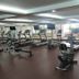S.M. Grande Residence Bangkok fitness center with treadmills, ellipticals and weight benches