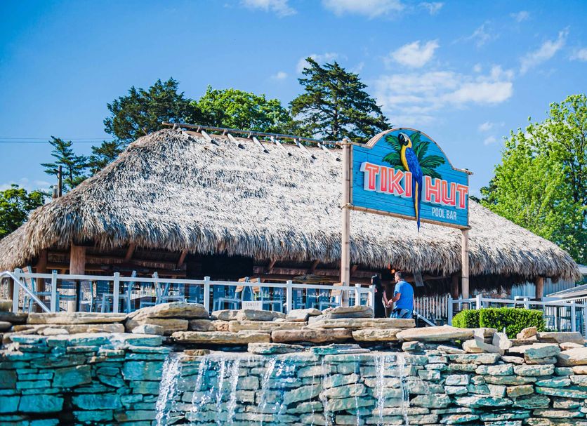 Margaritaville Lake Resort Lake of the Ozarks in Osage Beach, tiki hut by a pool with waterfall feature