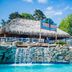 Margaritaville Lake Resort Lake of the Ozarks in Osage Beach, tiki hut by a pool with waterfall feature