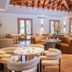 Maradiva Villas Resort & Spa in Flic en Flac lounge with curved seating and wooden ceiling