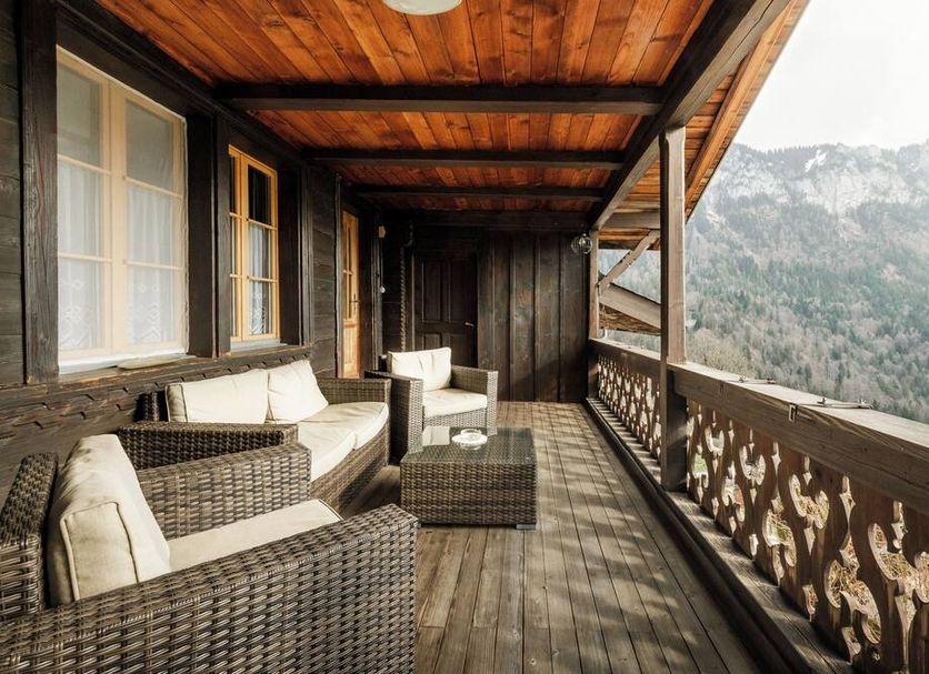 Gasthof Bären in Habkern balcony with wicker seating and mountain views