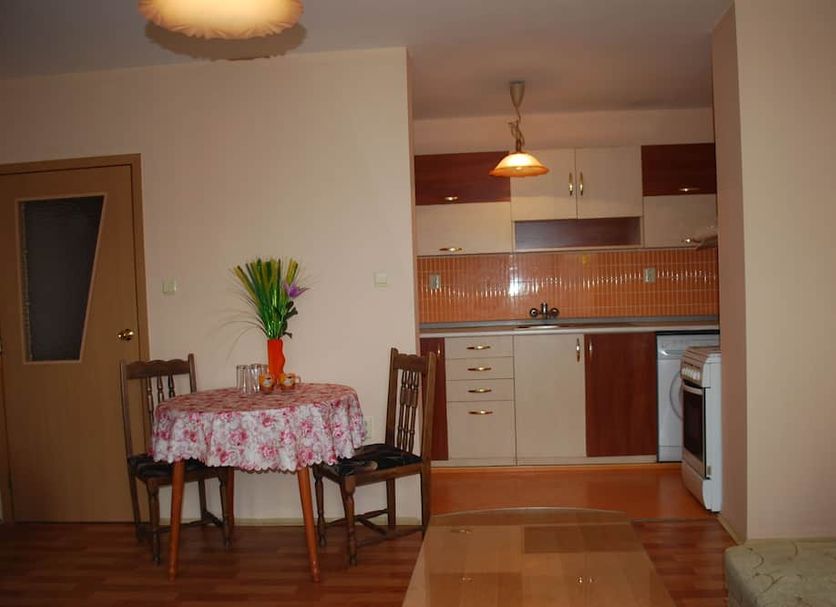 City Stay In Varna apartment interior with kitchenette, small dining table, and chairs