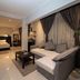 Helio Cairo Hotel in Cairo: spacious suite with sofa, coffee table, and view to a bedroom