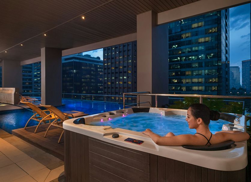 Citadines Salcedo Makati rooftop hot tub and pool with city skyline view in Makati