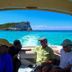 Stella Maris Resort Club guests on a boat with turquoise water and island view in Stella Maris