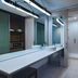 Aloft Waco Downtown bathroom with double vanity, large mirror and glass-enclosed shower in Waco