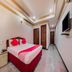 Hotel Ik London Residency Hyderabad compact guest room with double bed and wall-mounted TV