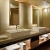 The Westin Miyako Kyoto bathroom with double vessel sinks, lit mirror, and wood ceiling