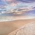 Ocean Breeze Inn Vero Beach beach view at sunset with sandy shoreline and calm ocean