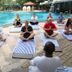 Yoga class by the pool at Siddhalepa Ayurveda Resort in Molligoda