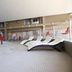Indoor pool at Medicine Hat Suites in Medicine Hat with lounge chairs and a splash feature