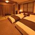 Dormy Inn Premium Otaru Natural Hot Spring room with two twin beds and tatami seating in Otaru