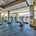 Lawhill Luxury Apartments gym in Cape Town with cardio machines and floor-to-ceiling harbor views