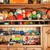 Pension Hoshi Ni Negaiwo in Furano, colorful plush dolls and toy cars displayed on wooden shelves