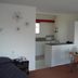 Midtown Motor Inn Whanganui room with kitchenette, dining table, and bed