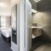 Nightcap at Sandown Park Hotel room with bed, desk and en suite bathroom in Noble Park