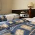 Hotel Town Nishikigawa in Kochi guest room with twin beds and bedside lamp