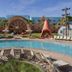 Disney's Art Of Animation Resort in Lake Buena Vista with pool, loungers and colorful hotel exterior