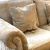 The Coast Yard B & B and Garden Chalets in Chichester features a beige floral-patterned sofa with cushions