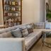 Bahia Del Duque in Adeje: elegant lounge with sectional sofa, armchairs, round glass table and tall palms