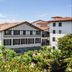 Logis Hotel Bergeret Sport in Hendaye with traditional facade and lush garden views