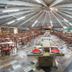 Hotel Vilage Inn Poços de Caldas buffet dining hall with tables under a circular ceiling