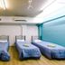 Global Backpackers Cairns Central dorm room with three single beds in Cairns