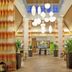 Hilton Garden Inn Birmingham SE/Liberty Park lobby with hanging lights, tall columns and potted plants