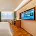 James Joyce Coffetel Hotel Qinhuangdao room with twin beds, desk, and city-view window