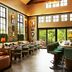 Berkshires Untold in Lenox: warm restaurant interior with leather sofa, long dining tables and large windows
