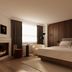 Metcalfe Montreal hotel room in Montreal with a king bed, fireplace, and lounge chair
