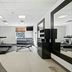 Hilton Garden Inn Winchester fitness center with treadmills, weights, and large mirror