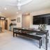 Ashmore Palms Holiday Village in Ashmore living area with sofa, dining table, TV and kitchenette