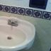 Oasis Tepoztlán bathroom sink with white basin and blue tile accents in Tepoztlán
