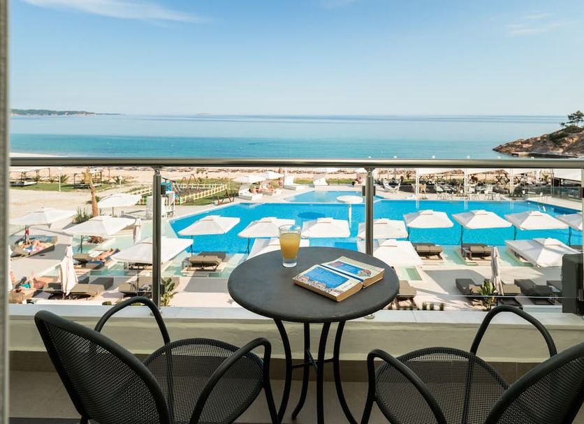 Hotel Blue Dream Palace Tripiti Resort in Limenaria with balcony sea view over pool and beach